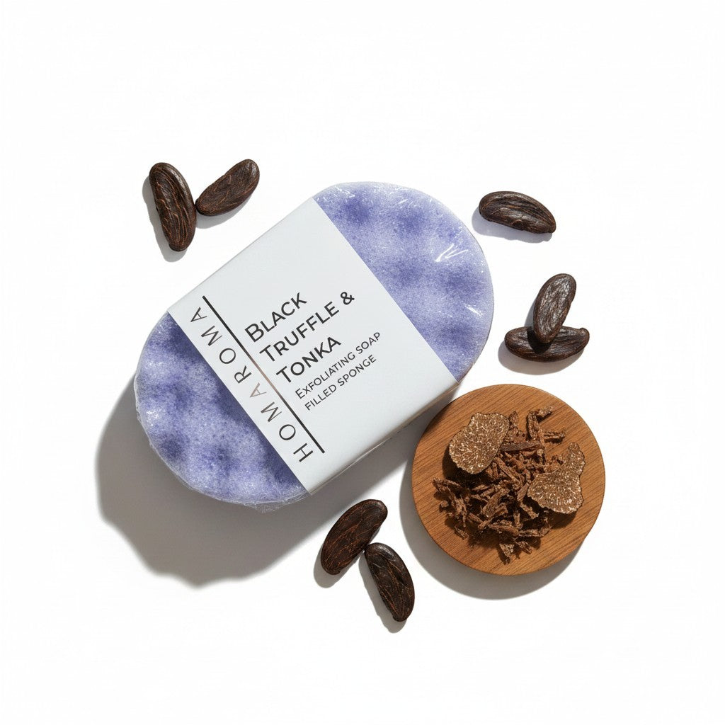 Homaroma Black Truffle & Tonka exfoliating soap-filled sponge in lavender, with cocoa beans and truffle shavings.