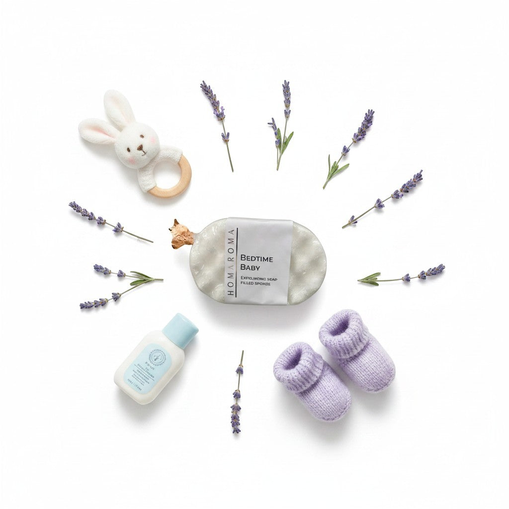 Homaroma Bedtime Baby exfoliating soap-filled sponge with lavender, baby booties, and a bunny rattle.