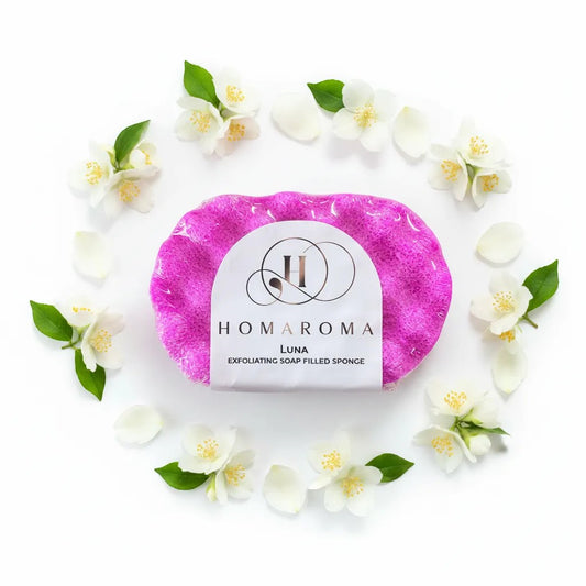 Homaroma Luna pink exfoliating soap-filled sponge with white jasmine flowers and petals arranged in a circle.
